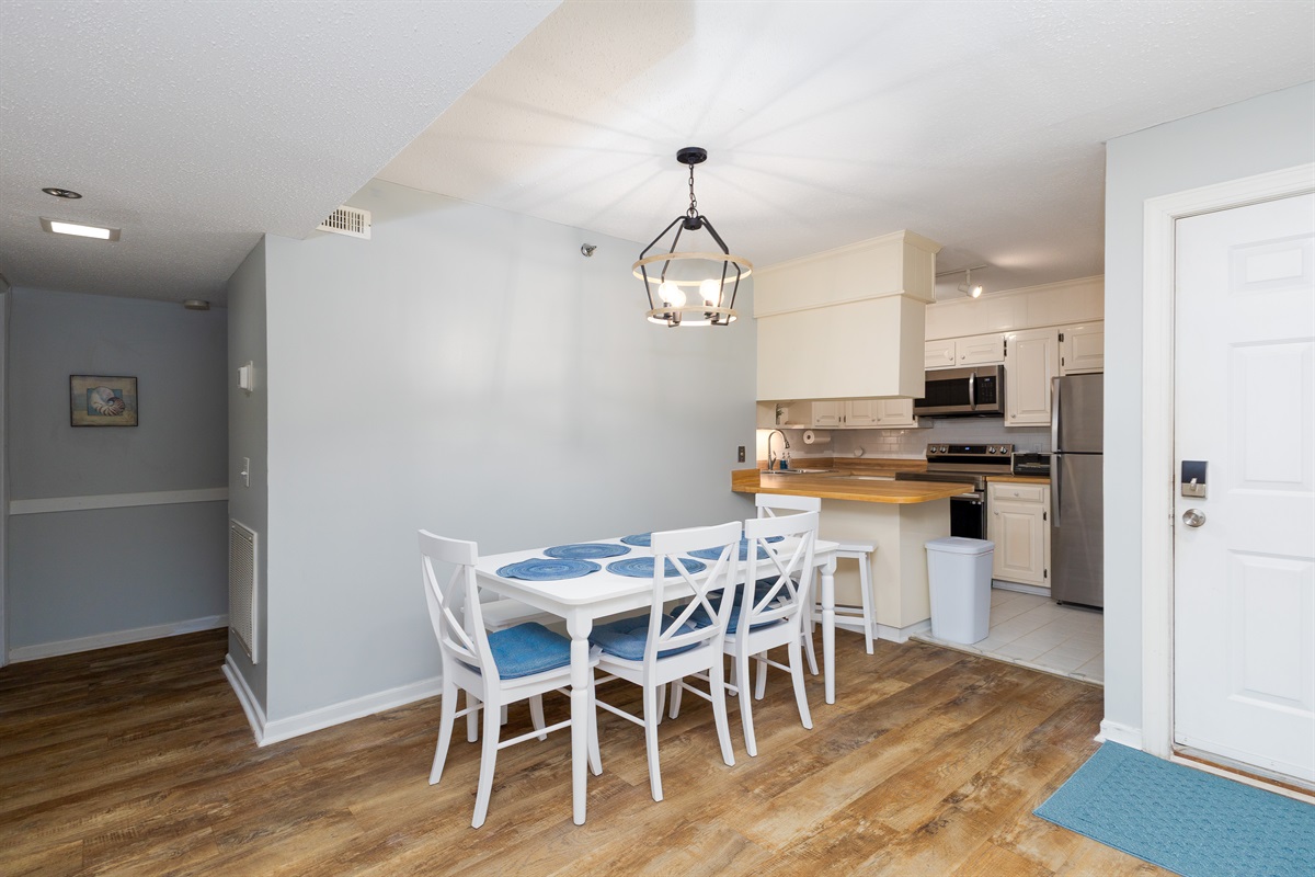 Elegant kitchen with dining table and cabinetry