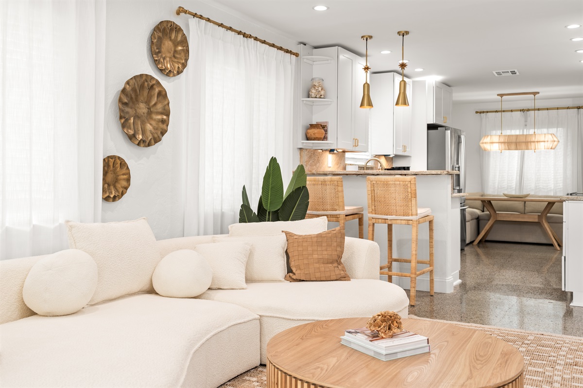 Bright, airy living space designed for effortless relaxation.  Sink into the plush curved sofa and unwind after a day of adventure.