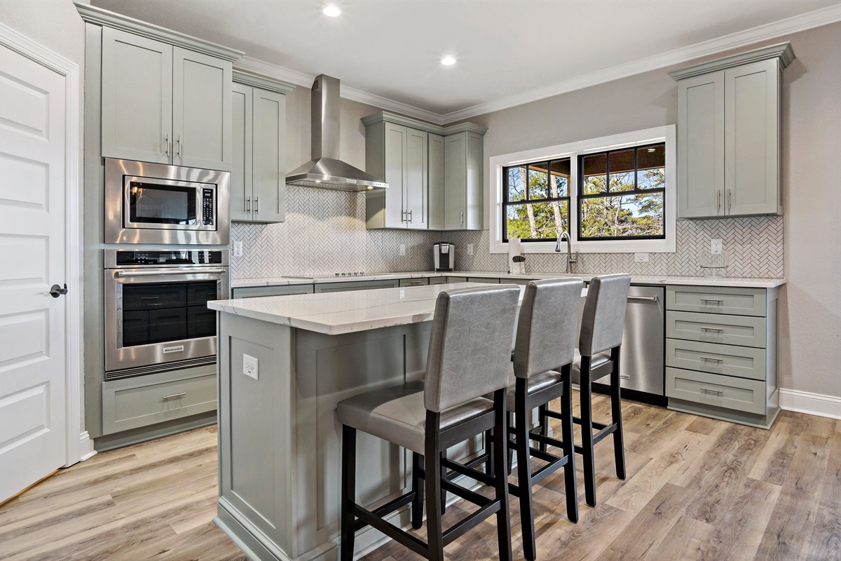 Stainless steel appliances and flat top stove with hood