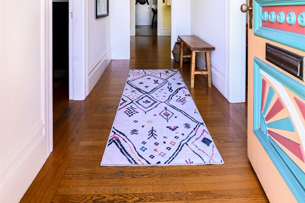 Step inside to discover a surprisingly spacious interior featuring 11-ft ceilings, hardwood flooring, Victorian chandeliers, and Victorian-perfect door frames, and original Victorian hardware.