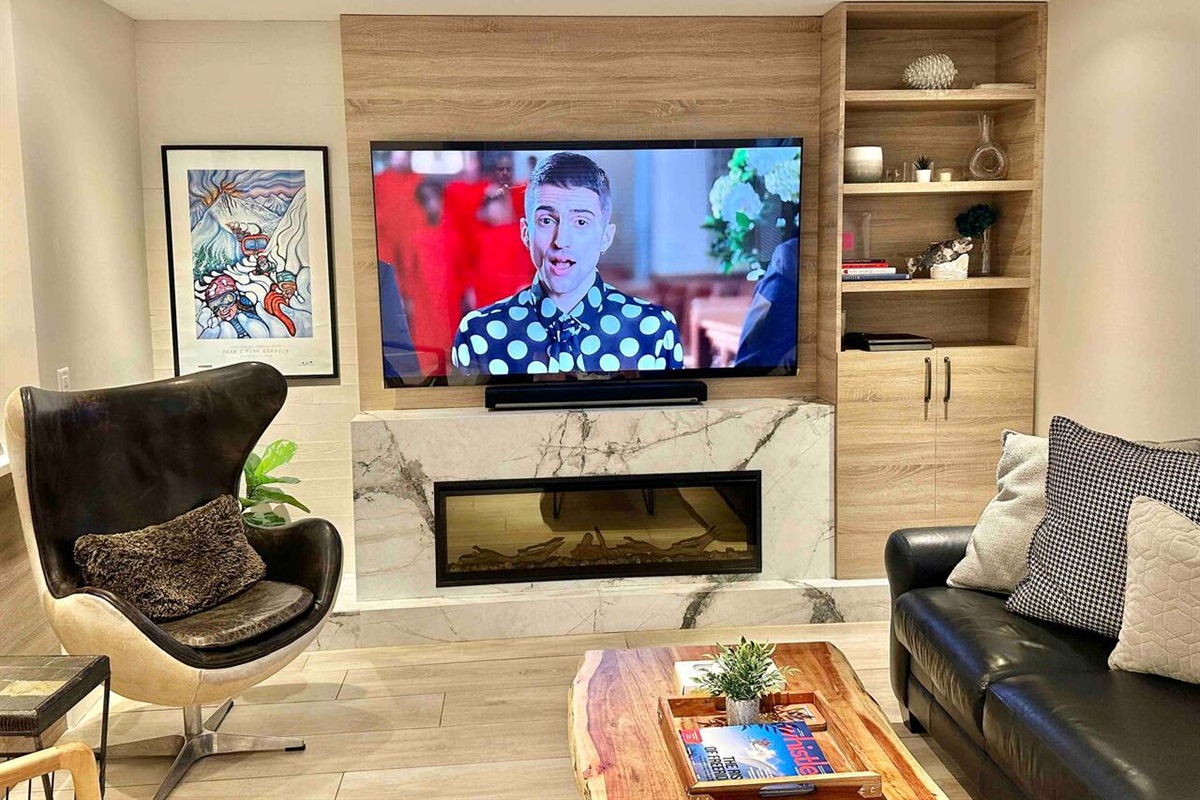 Living Room includes 77” LG OLED TV w/ Sonos Surround Sound + Playstation 5, Fireplace,  Seating for 10 ppl, heated floor, A/C, views of Blackcomb Mountain. Walk everywhere in village, vehicle not required. Bike, hike, ski from your door.    