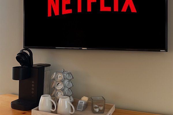 Kick back with a fresh cup of coffee and your favorite shows on Netflix. Enjoy premium streaming on a wall-mounted smart TV.
