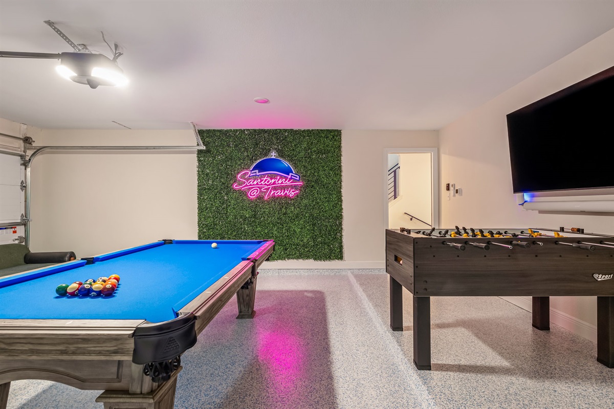 Fun-filled game room with pool table and foosball — perfect for friendly competition and group entertainment.