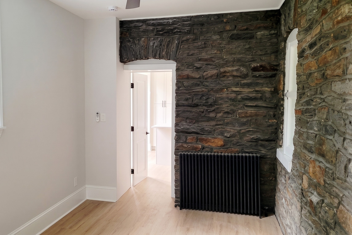 Exposed stone combined with updated finishes contribute to a cozy vibe.