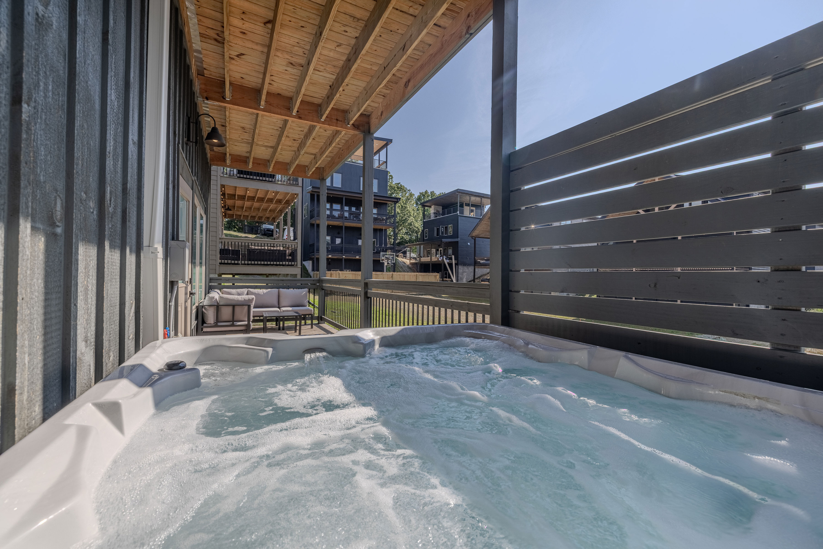 Hot Tub on lower level deck directly outside the pool room.