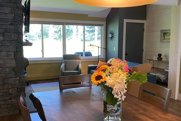 Large central dining space between kitchen and living room. Eat, work and play.