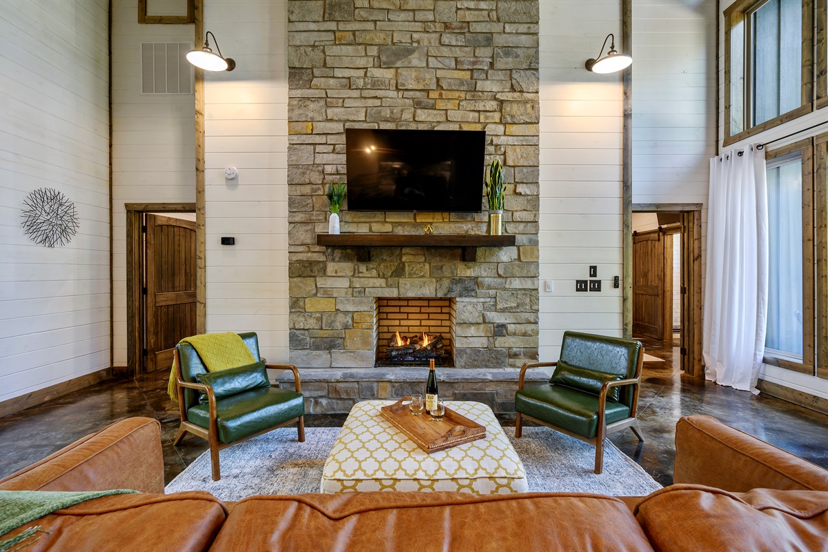 Comfortable lounge space centered around a stone fireplace