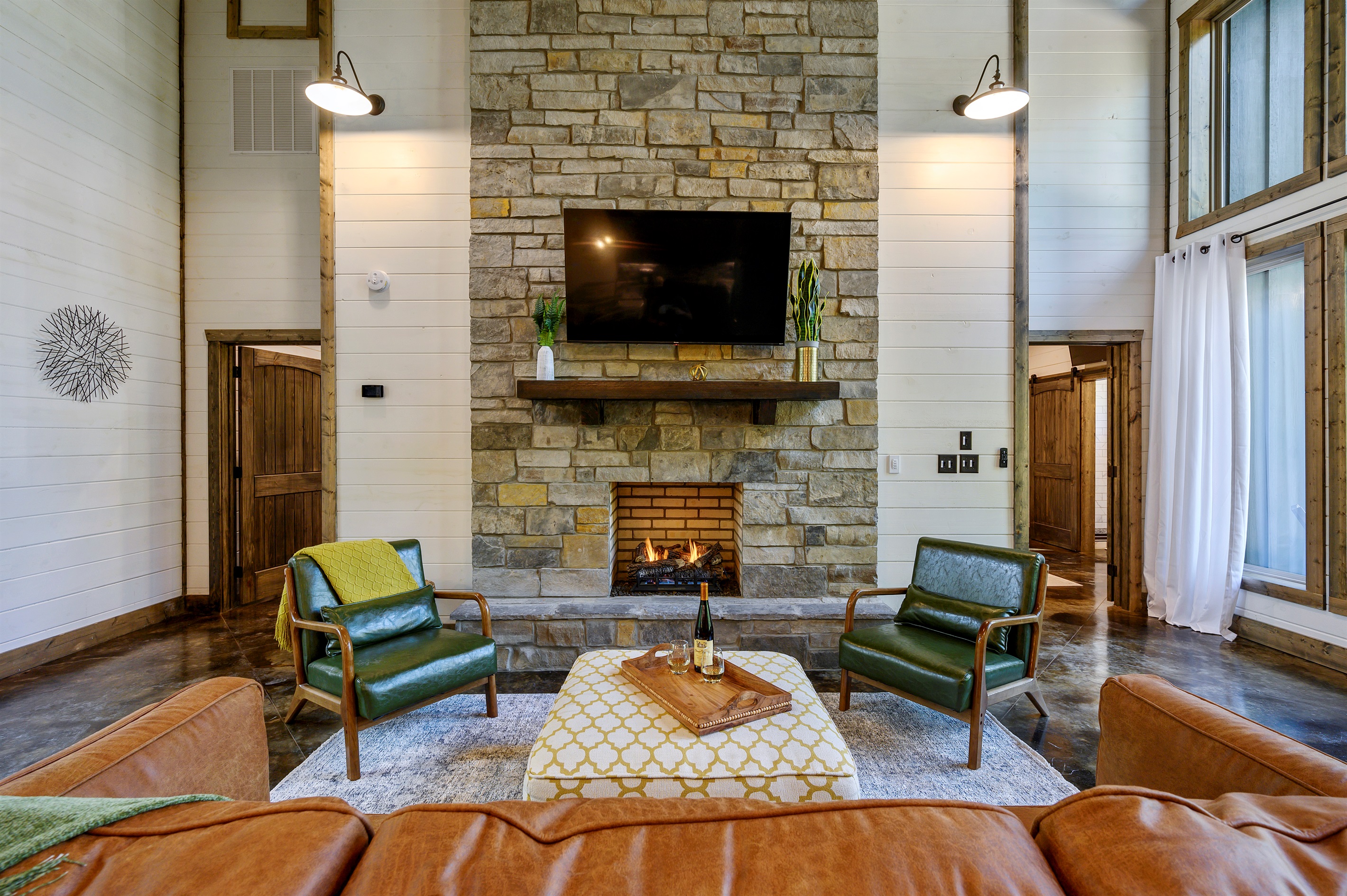 Comfortable lounge space centered around a stone fireplace