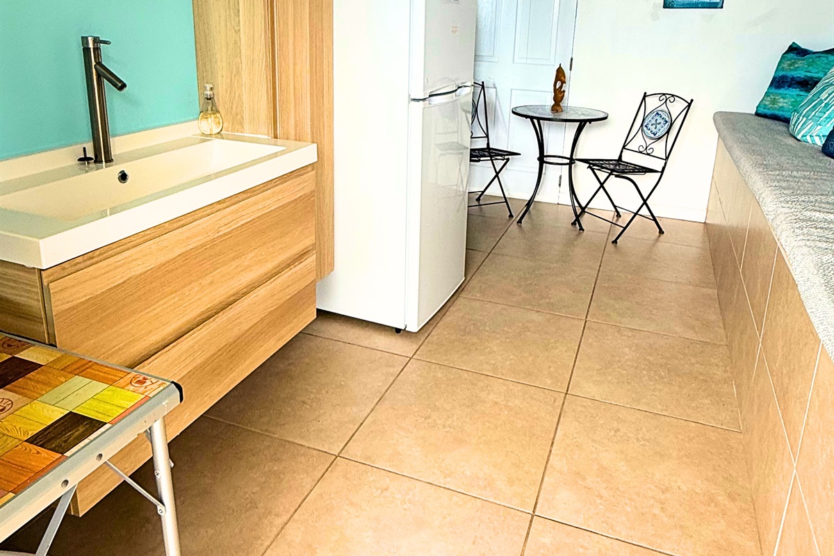 The Cruzan room has a fridge and small seating area