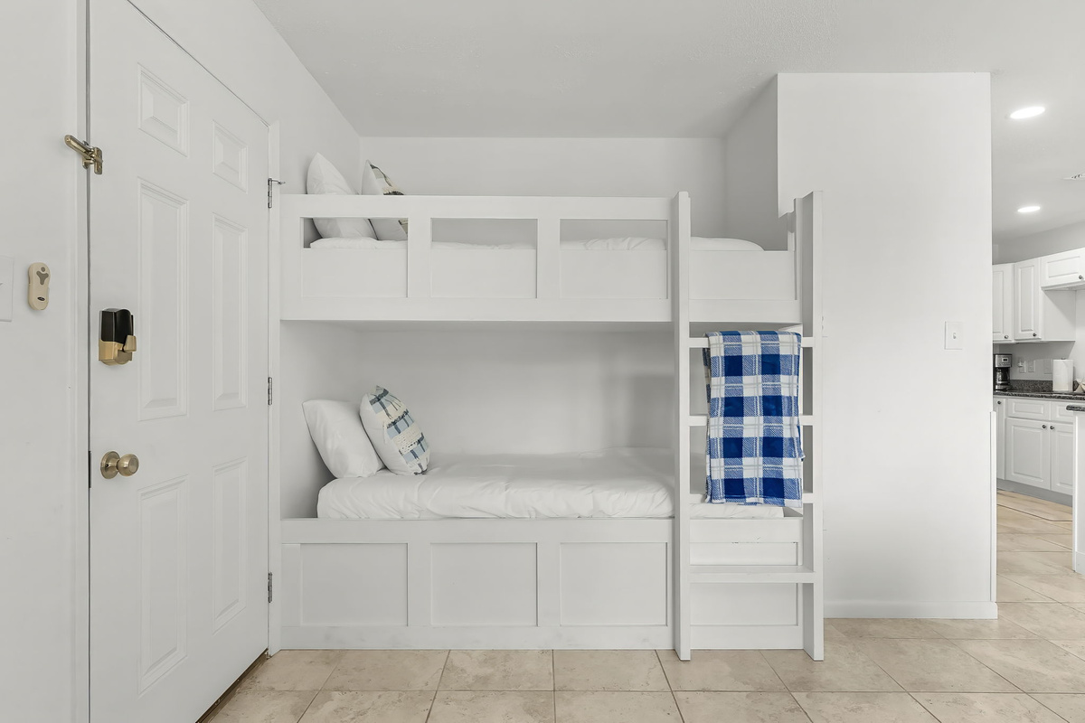 Two twin bunk beds in the common area