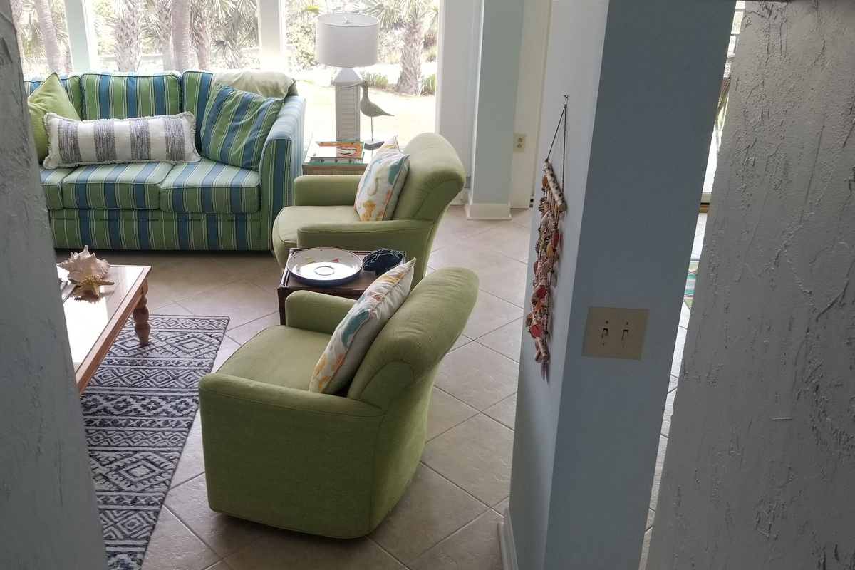 looking down into living room from foyer area at entrance