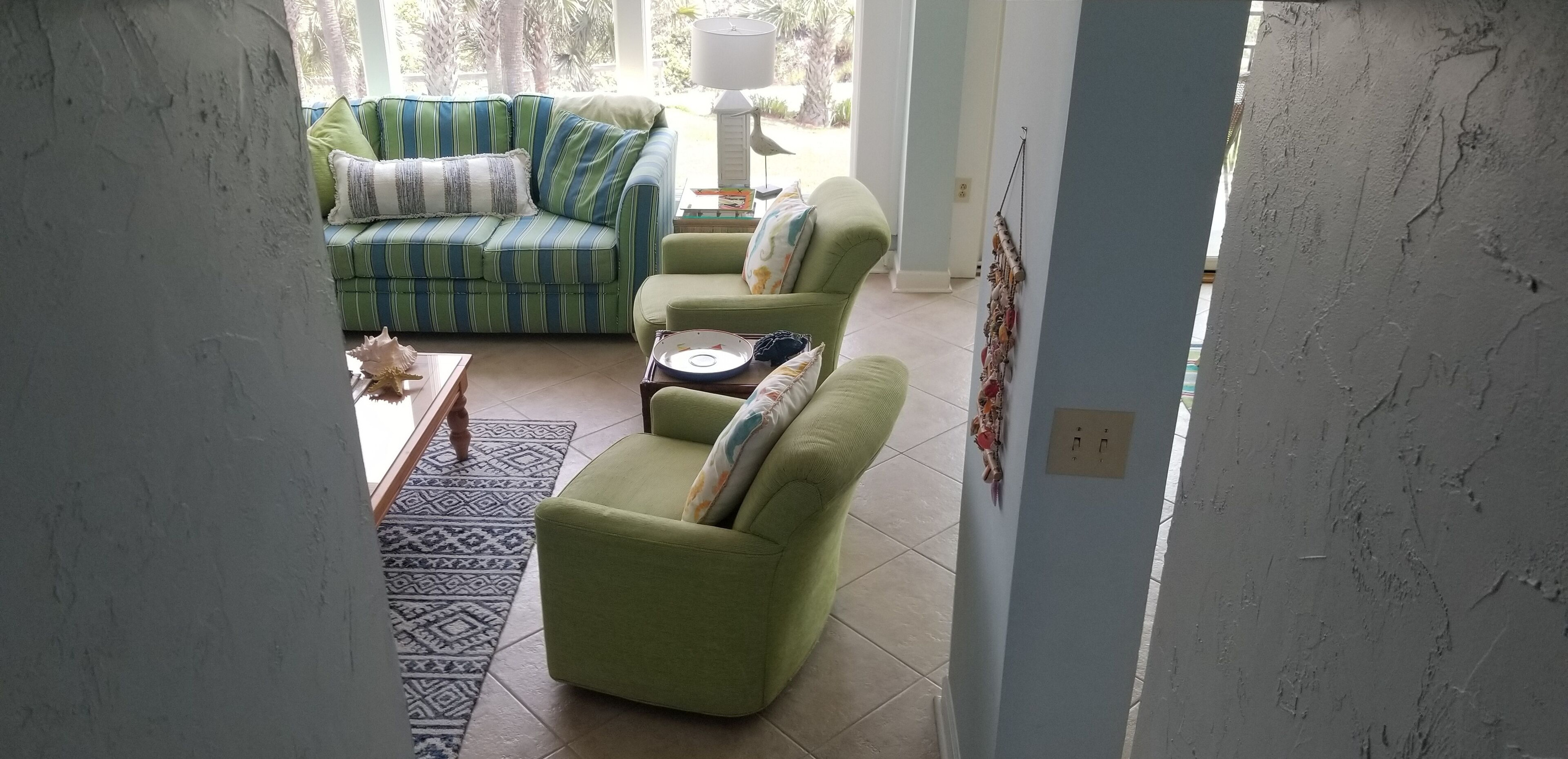 looking down into living room from foyer area at entrance