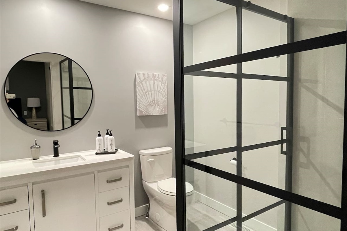Queen Bedroom - Ensuite Bathroom. Waterfall Shower. Shampoo. Conditioner. Body Wash. 