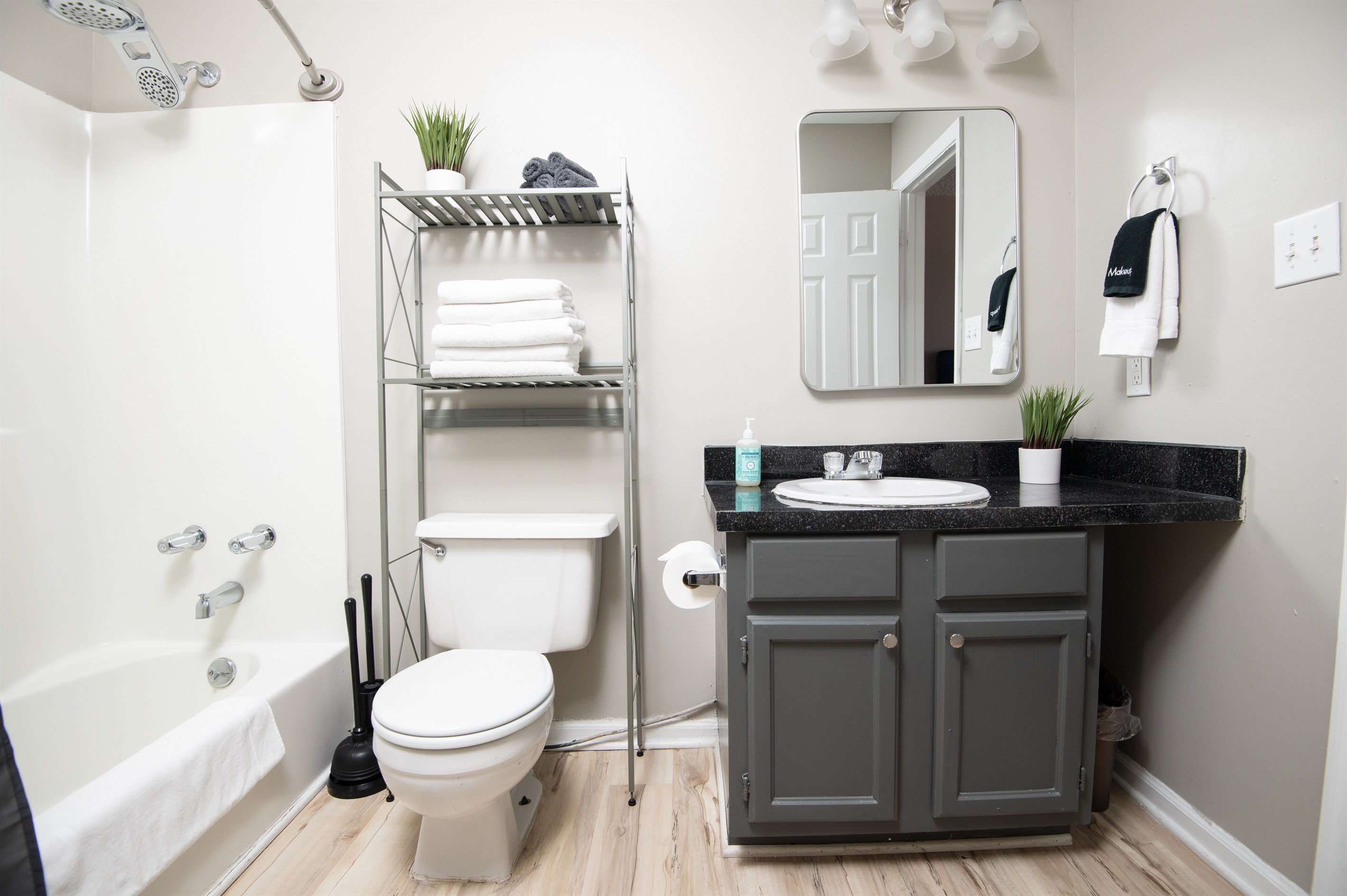 This ensuite bathroom is attached to the double queen room. Both bathrooms come complete with shampoo, body wash, conditioner, hand soap, and all the linens you need for a comfy stay.