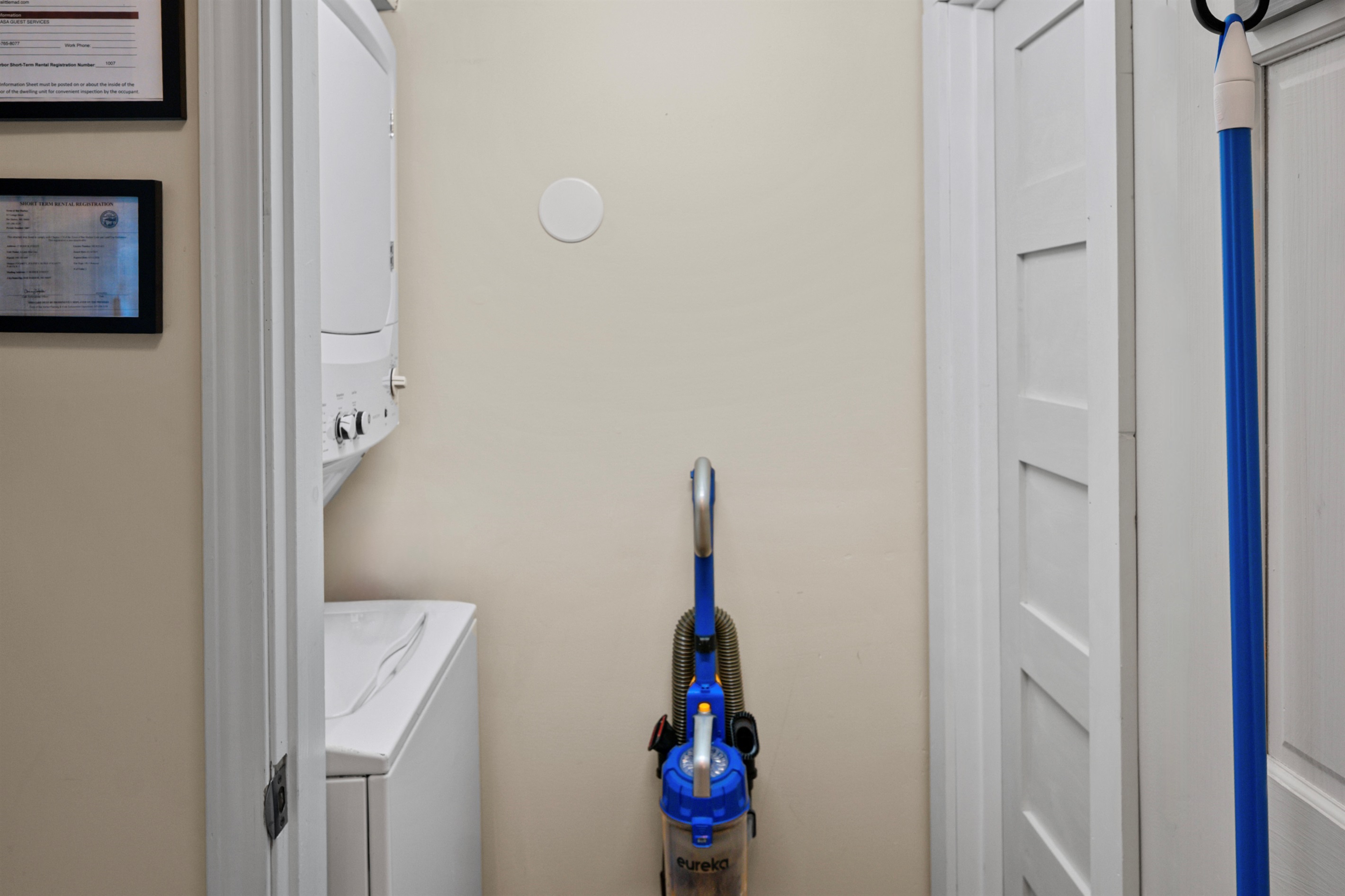 The laundry comes equipped with a full size washing machine and dryer