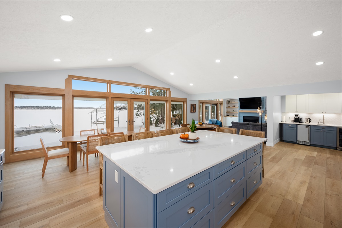 Open-concept kitchen and dining space overlooking the water