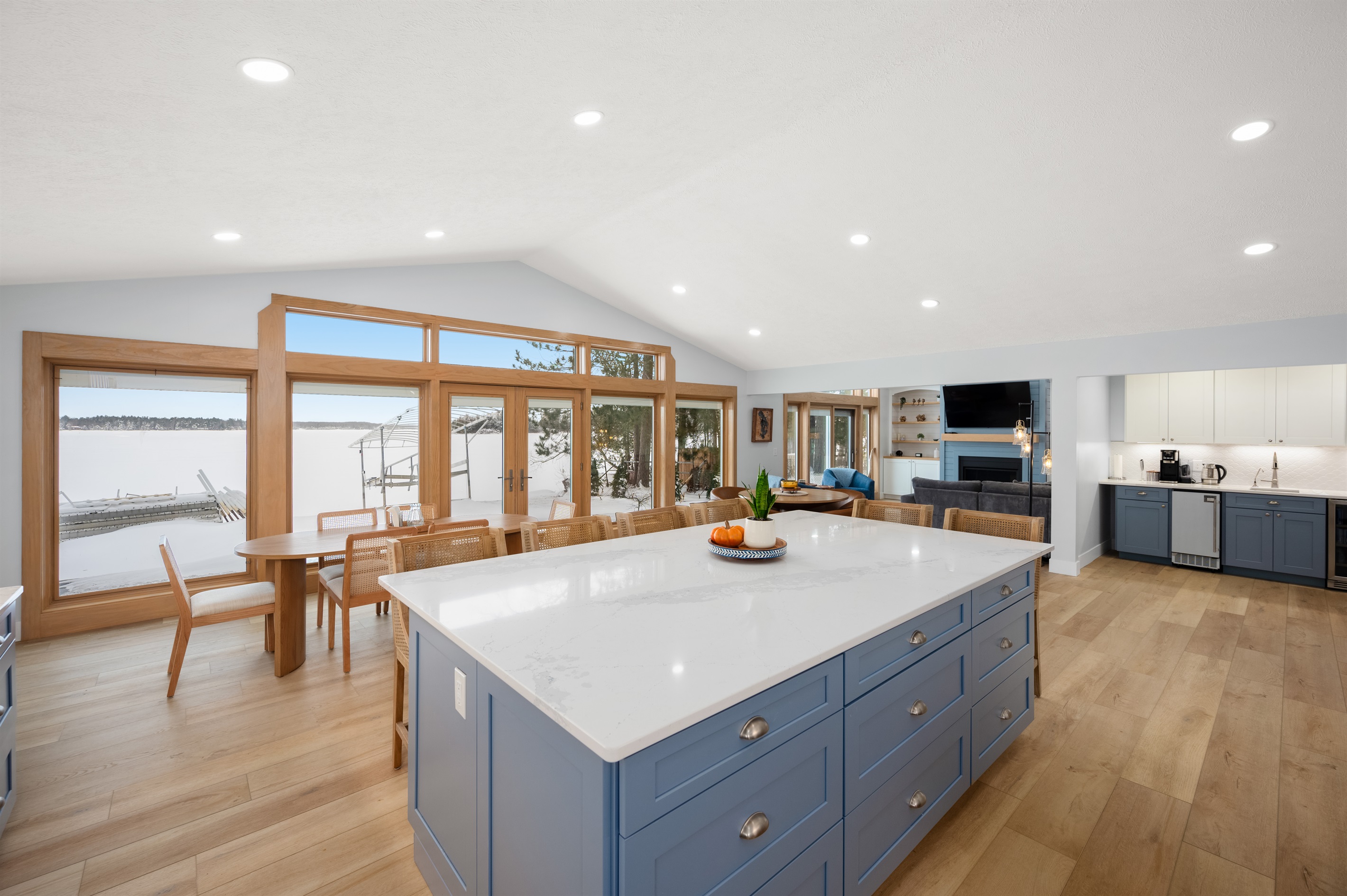Open-concept kitchen and dining space overlooking the water