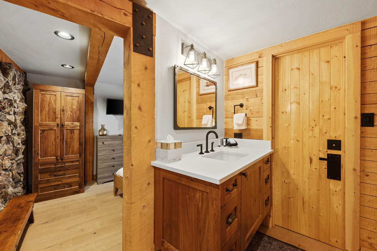 Primary Suite split-section bathroom. This section has large single vanity. 
