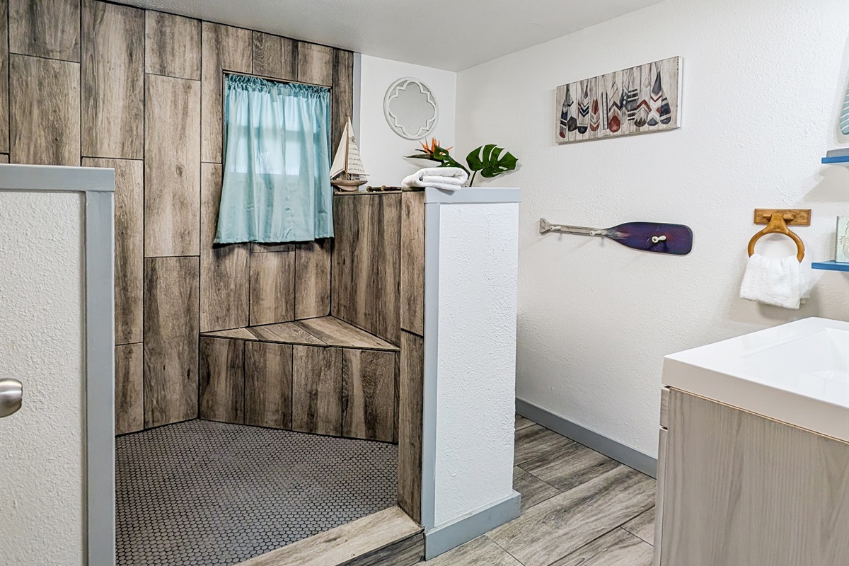 Huge, bright bathroom with walk in shower