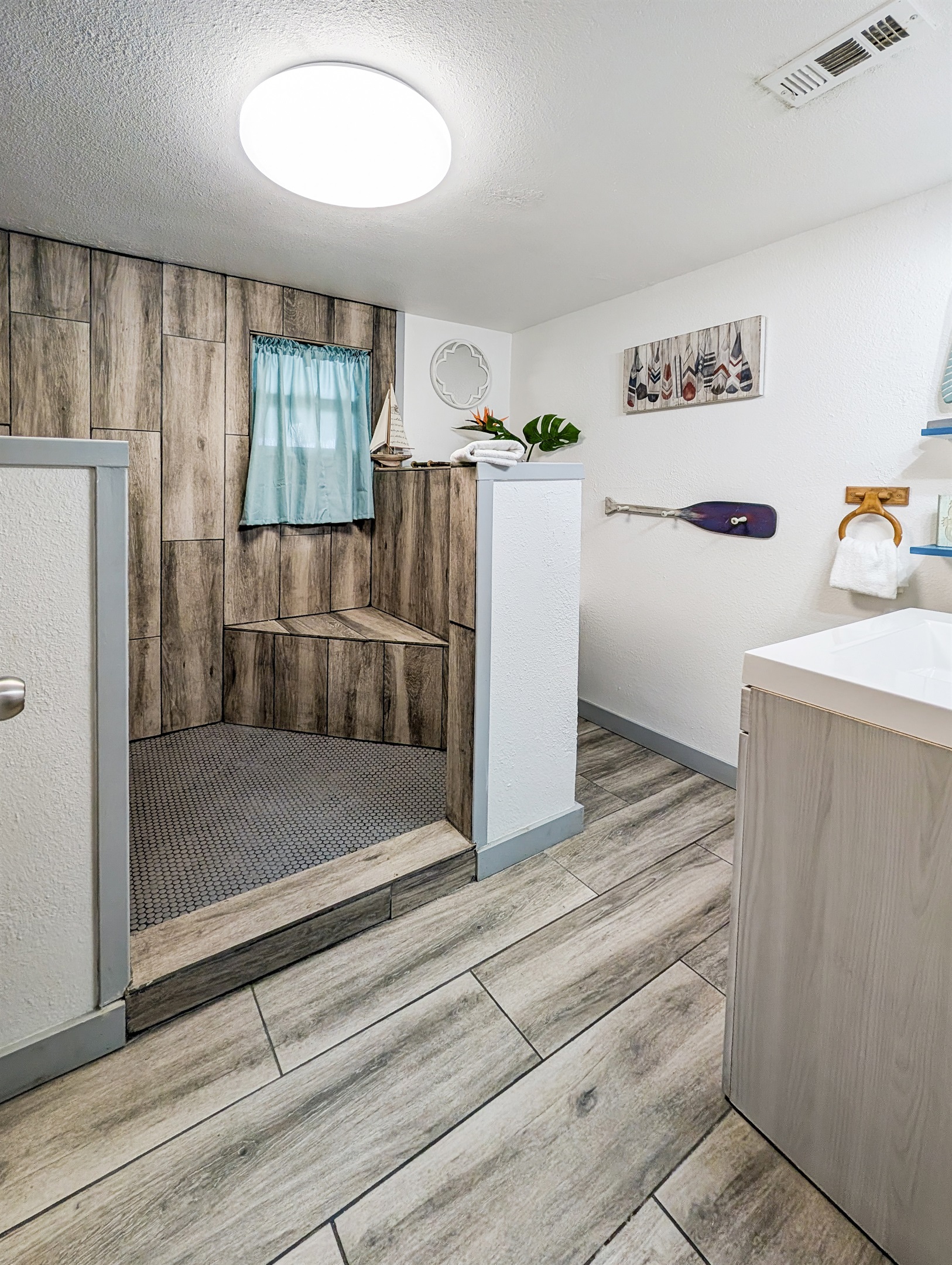 Huge, bright bathroom with walk in shower