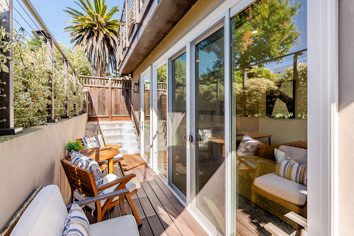 Comfy dedicated patio with pair of lounge chairs & bistro set for two