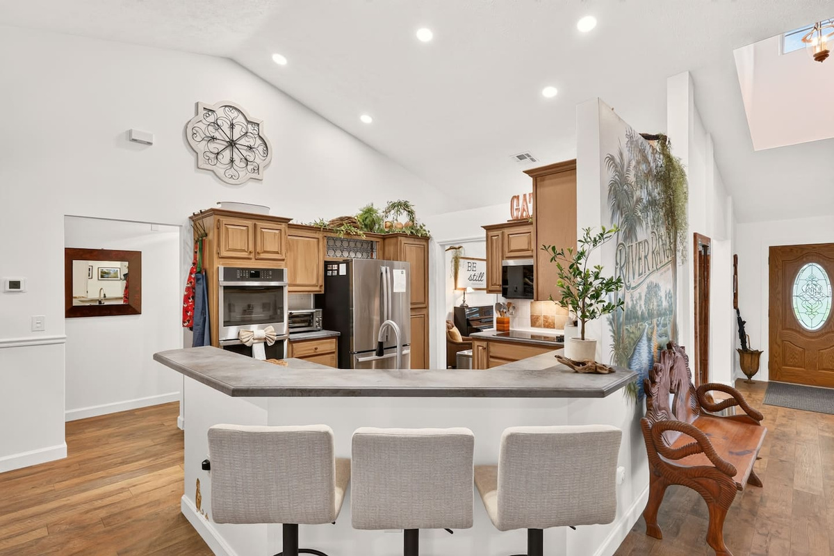 The kitchen is fully stocked with all you need to prepare meals.  The kitchen features a double wall oven, glass cooktop, stainless steel fridge with ice and filtered water, a large sink, built in microwave and a toaster oven.