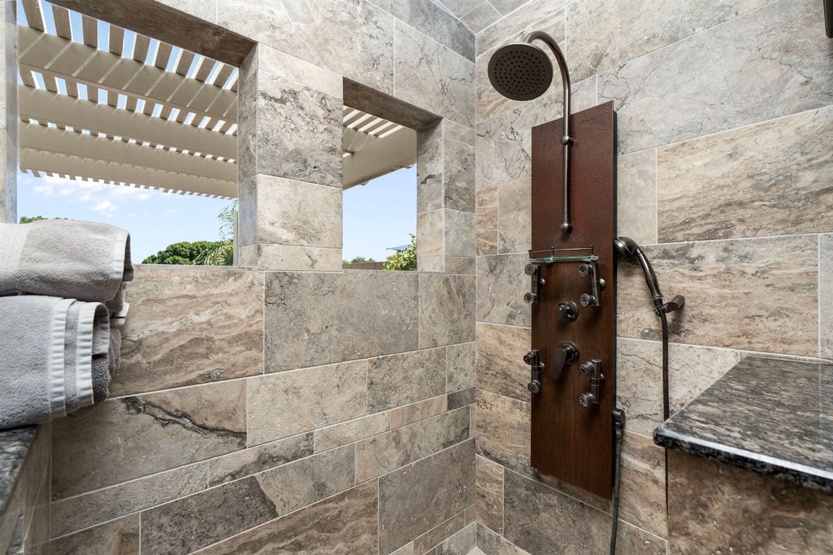 The oversized walk-in shower opens to the sky through a pergola window cutout — a rare and luxurious touch that makes every morning feel like a resort experience.