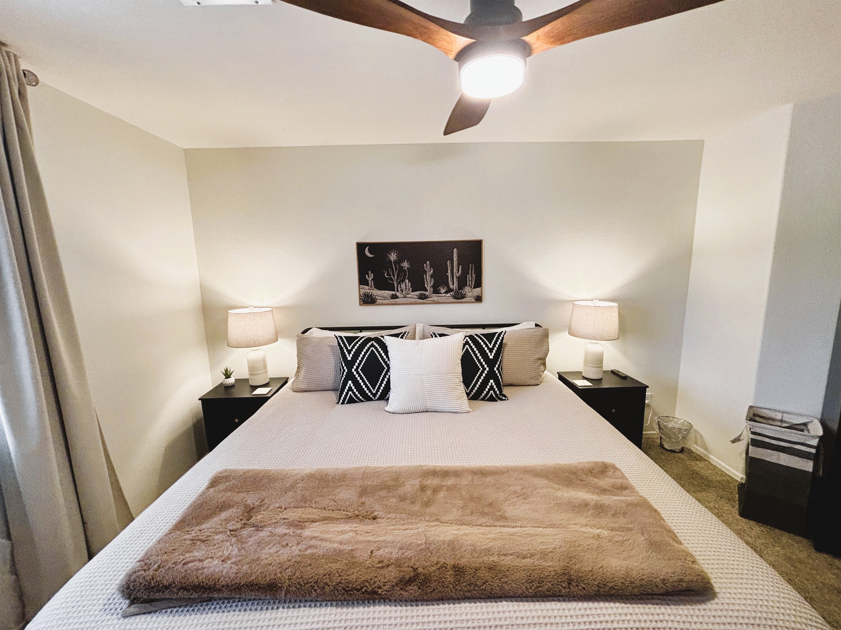 King bedroom upstairs with 55" Smart TV, Blackout curtains and ceiling fan