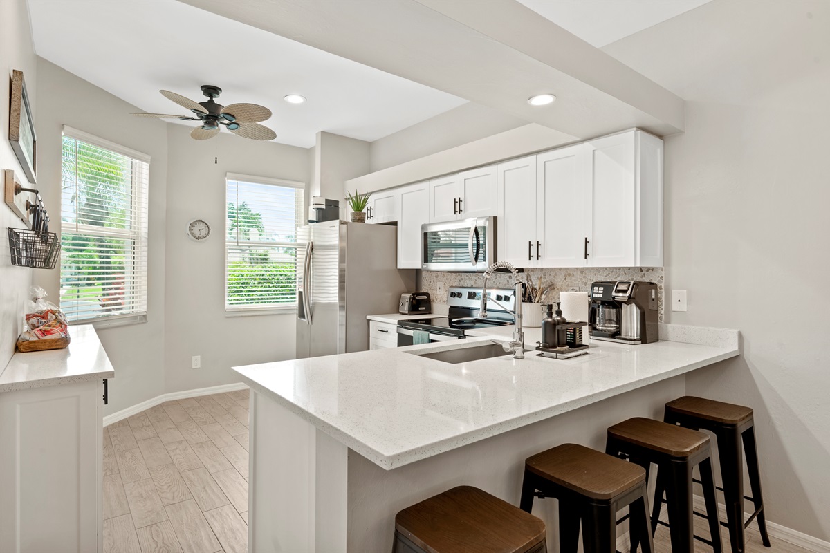 Casual dining bar with seating for four and views into the heart of the home
