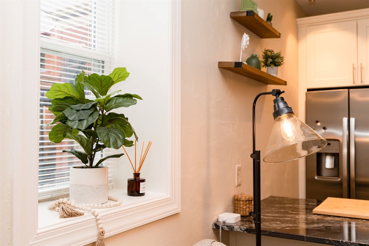 Bright living area window with a cozy lamp, creating a warm and inviting atmosphere.