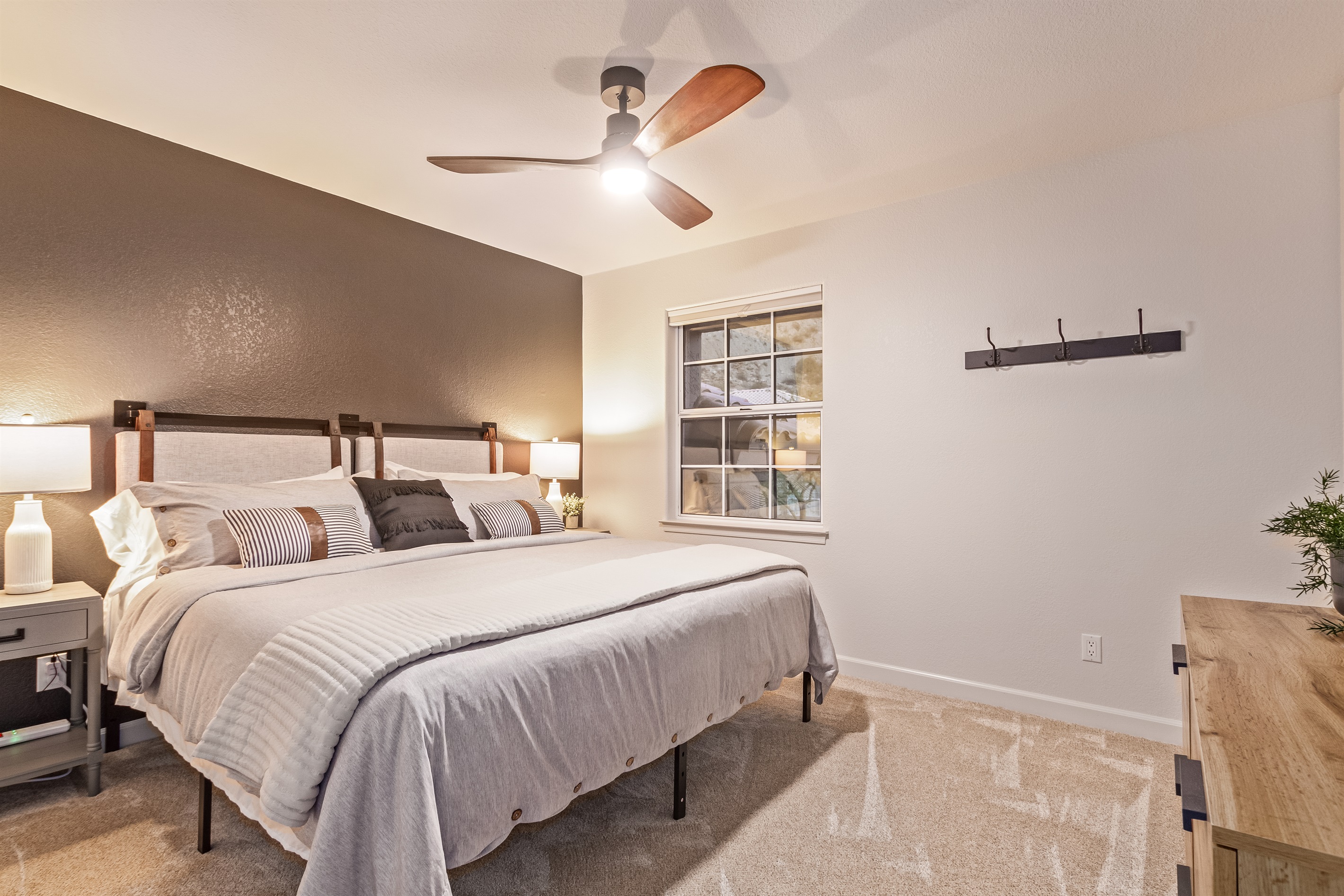 Third bedroom with king bed and 55" TV, linens, extra pillow and blankets, ceiling fan and room darkening shades 