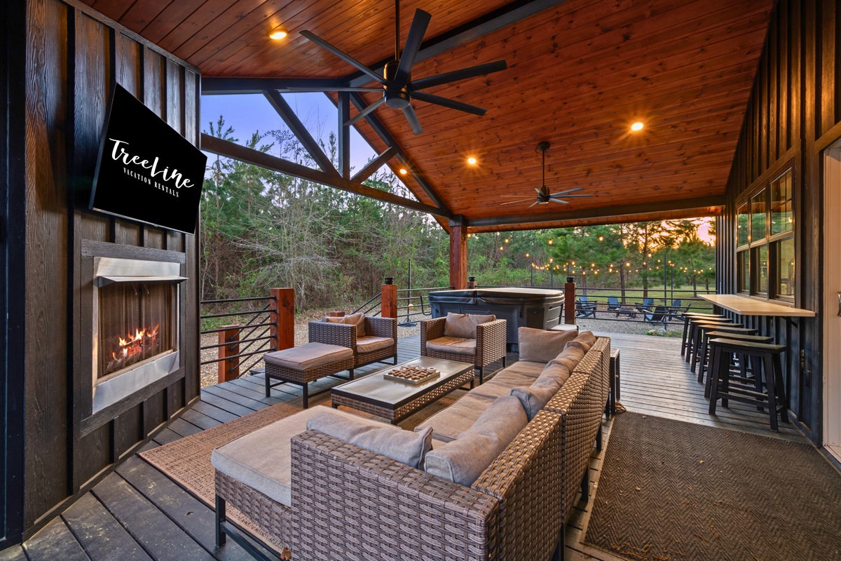 A closer look at the covered patio shows just how inviting this space is, whether you’re lounging during the day or enjoying a quiet evening.