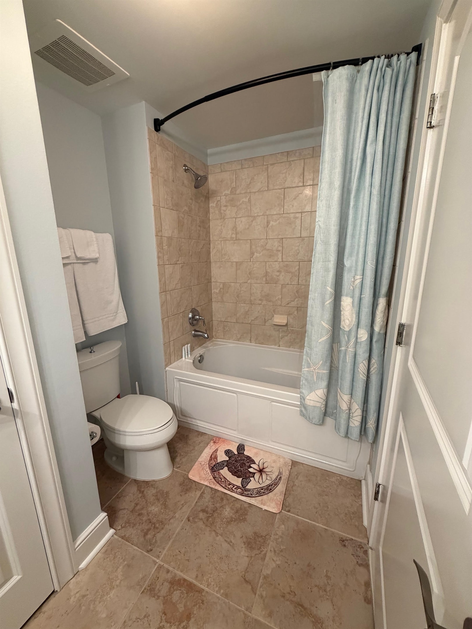 Third full bathroom with granite vanity and tub/shower combo—perfect for keeping everyone comfortable during busy beach mornings.