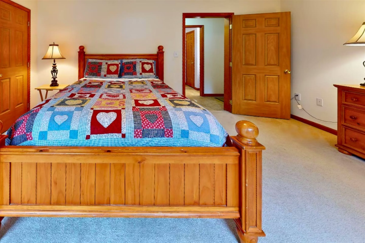 Second bedrooom on first floor with queen sized bed and full bathroom right across the hall!