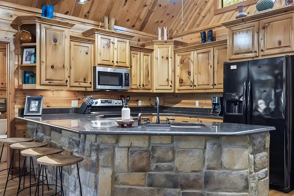 Gathering around the island is perfect for snacks, meals, or morning coffee.