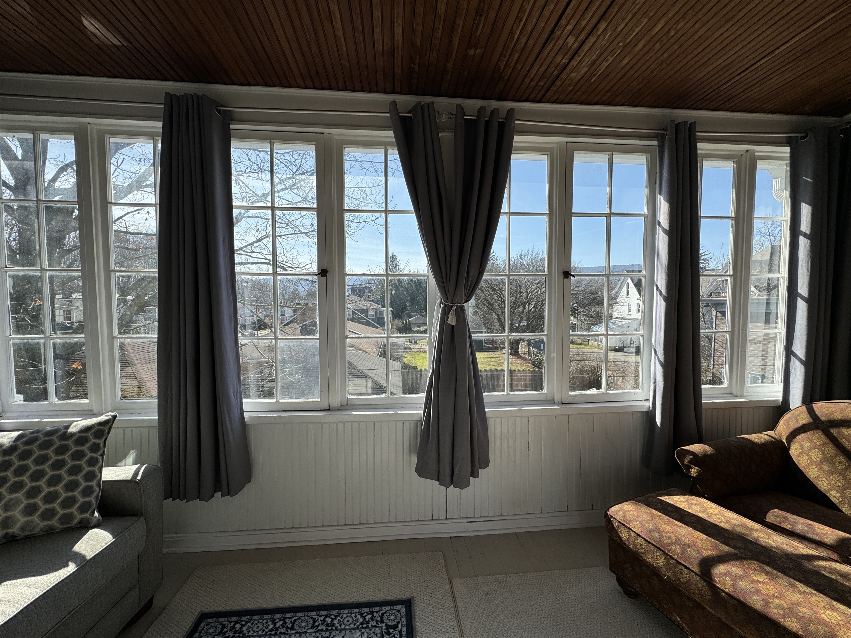 Sunporch overlooking neighborhood backyards