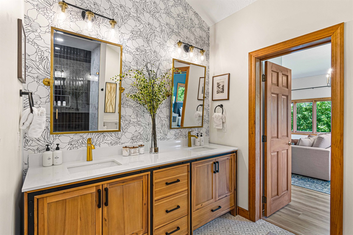 Double vanities are offered in this large bathroom, located off the Blue Ridge Suite..