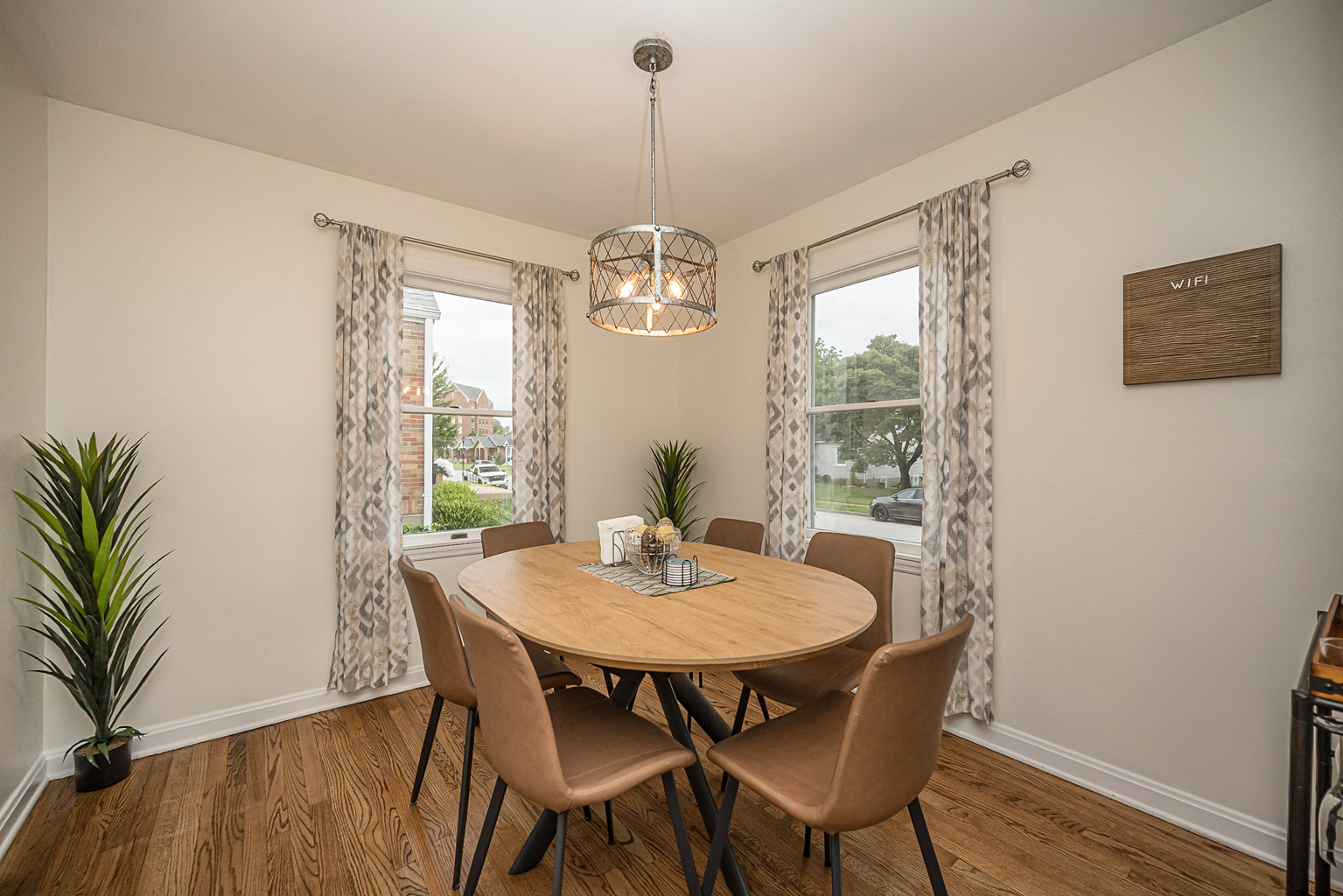 Dining table comfortably seats six for meals or game night. Two additional chairs are located in the closet.