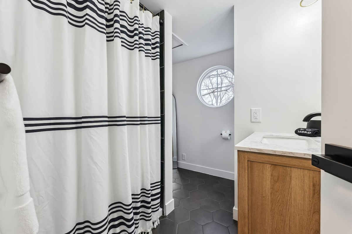 Large master bathroom with all the essentials.