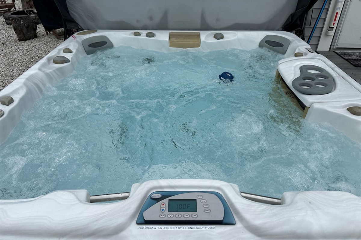 Dive into relaxation with this spacious private hot tub. Featuring multiple jets and a digital temperature display, it is the perfect spot to unwind and recharge.