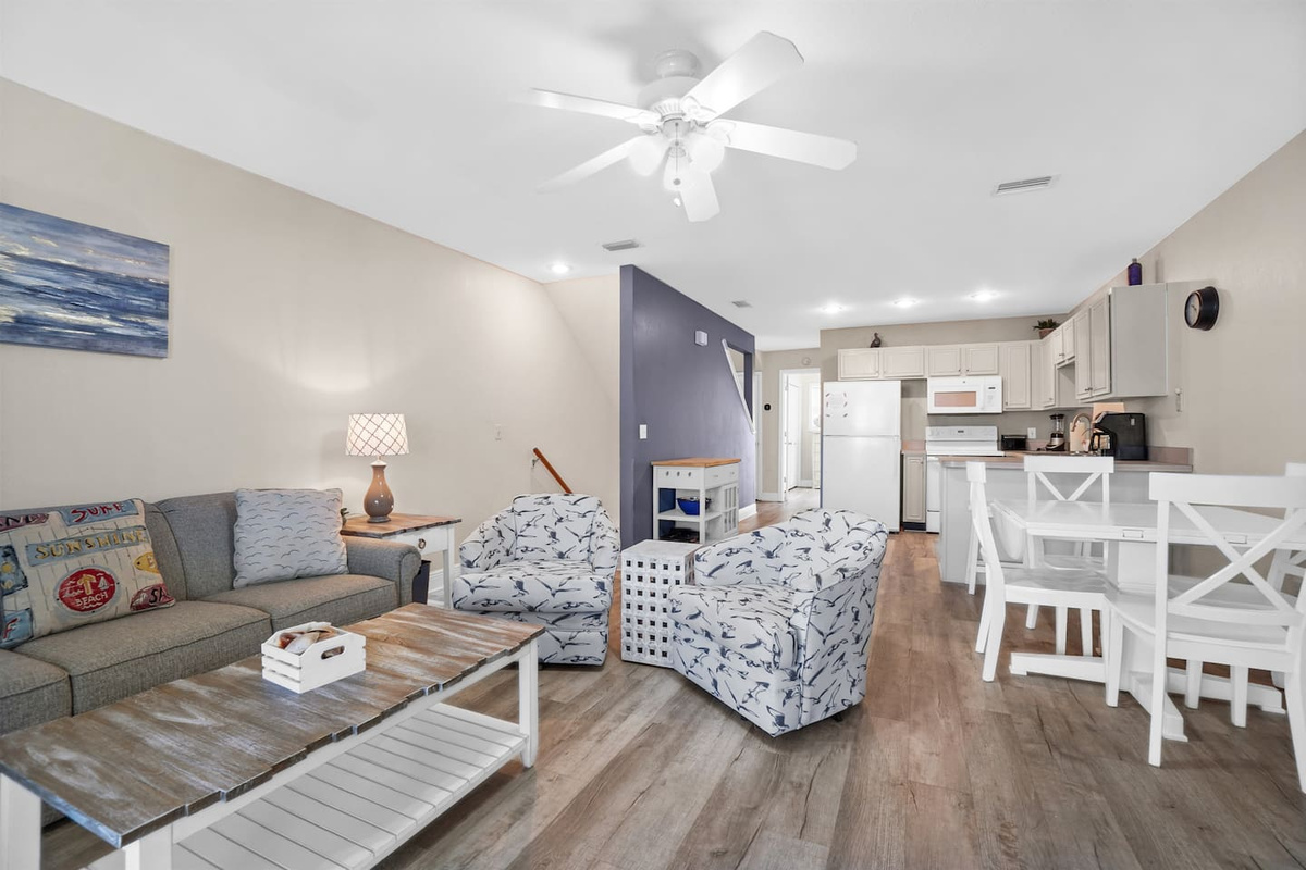 Spread out in the open main level &mdash; kitchen, dining, and living all connected, all bright with Gulf light.