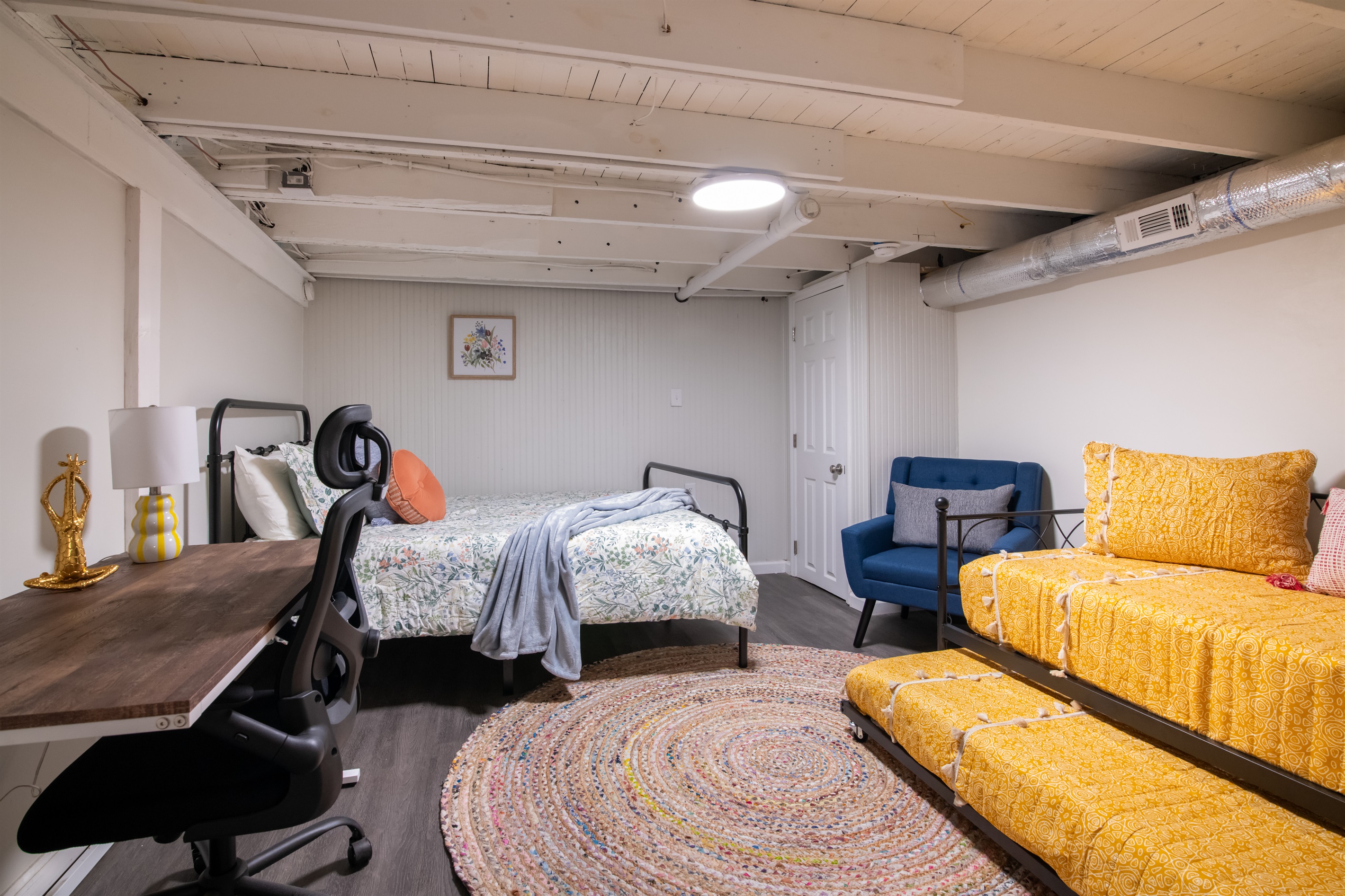 A fun and kid-friendly bedroom complete with comfy beds and playful colors,