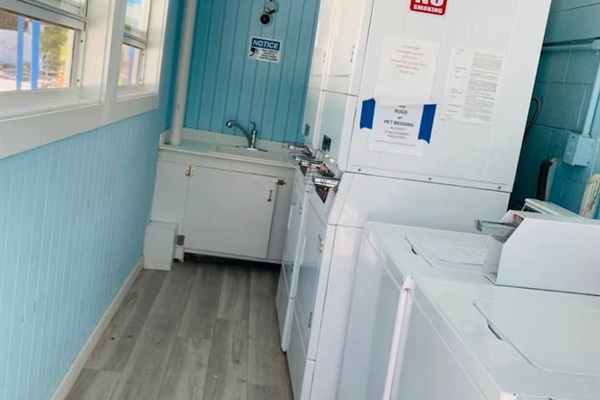 Coin operated laundry room. Open 24 hours. $2.00/wash & $2.00 to dry. 