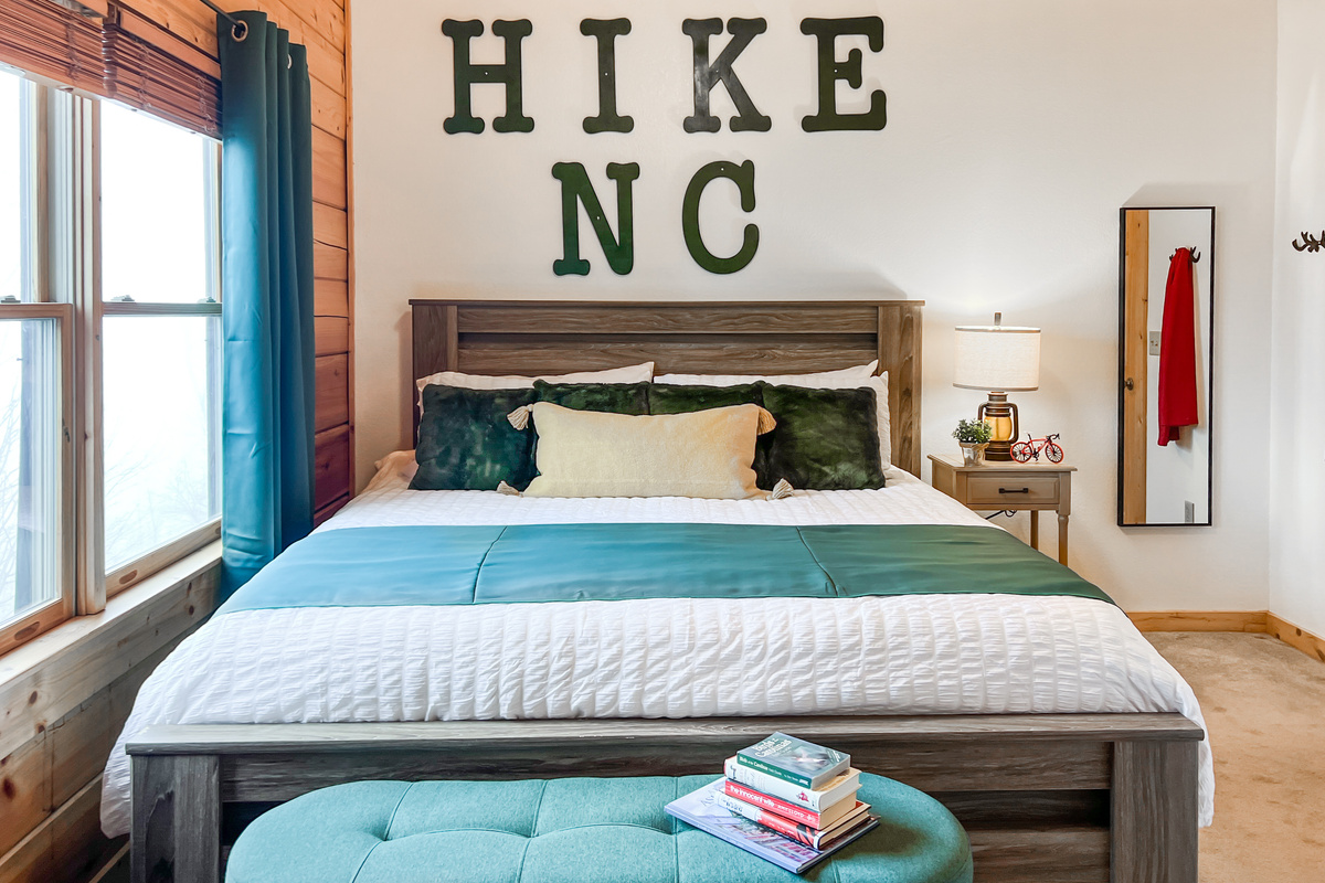 Second-floor Hike Room with a king bed, warm mountain décor and a comfortable private retreat for two guests.