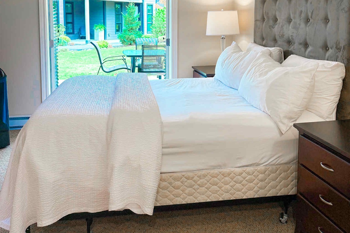 Unit A Primary Queen Bed - Double glass Patio doors.