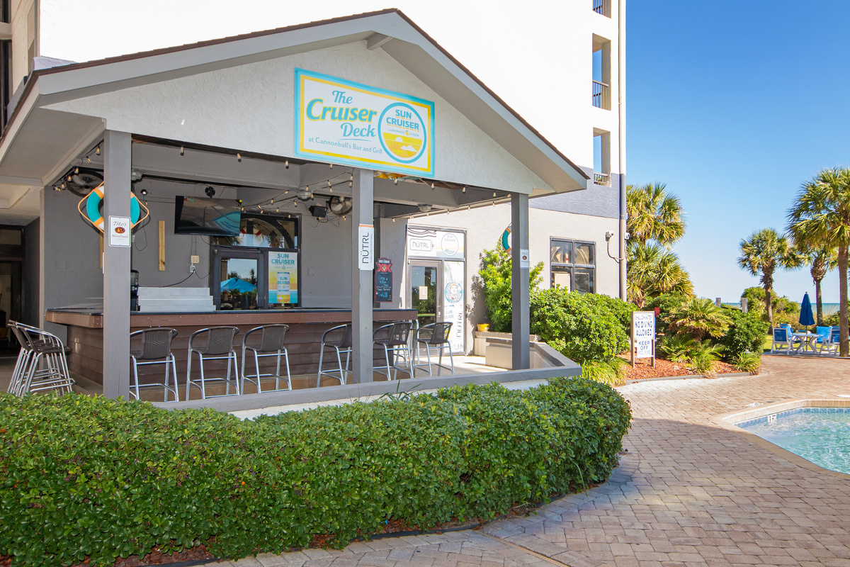 Grab a drink at the indoor/outdoor bar & grill, outside access is seasonal
