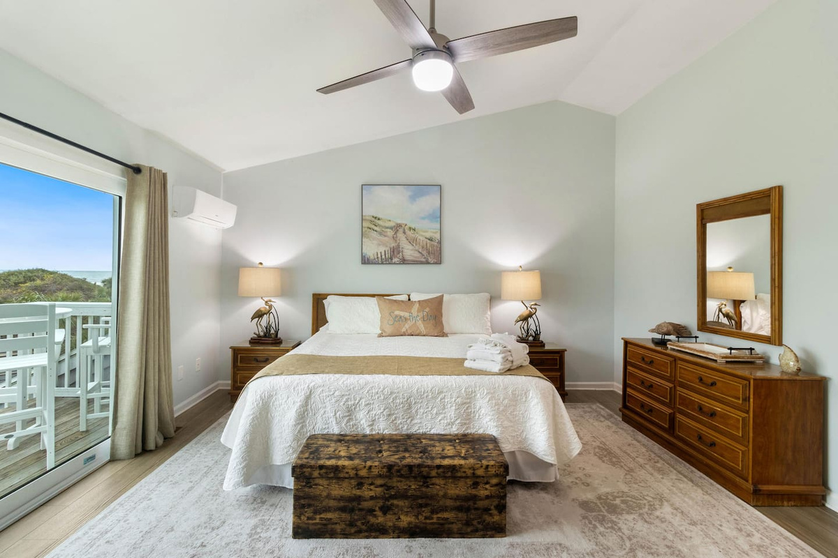Wake up in the king master suite &mdash; Gulf light through the windows, private deck waiting just outside.