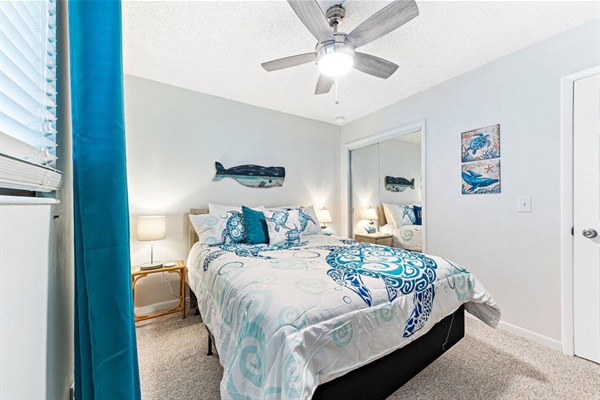 Second bedroom with queen sized bed, smart TV and closet