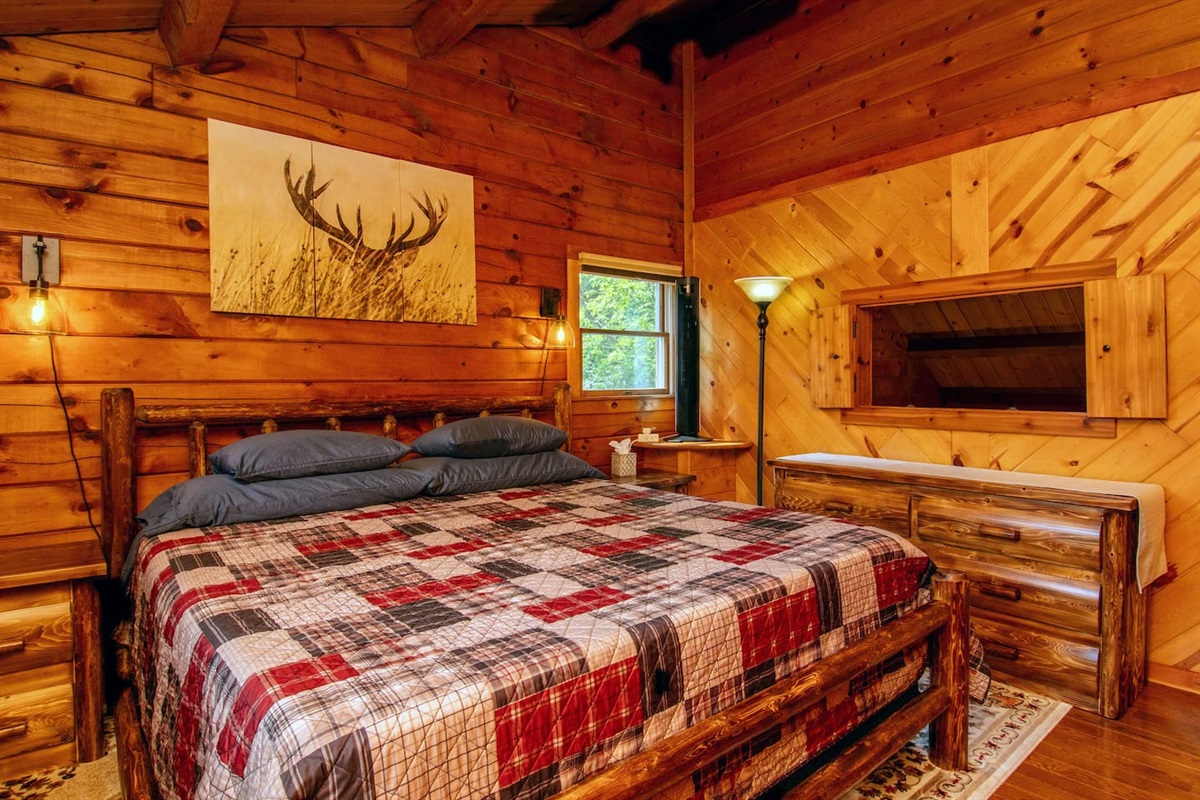 The shuttered window overlooks the vaulted living room. The window allows heat from the wood burning stove to enter the room.  There is forced air heat and central air in the house.