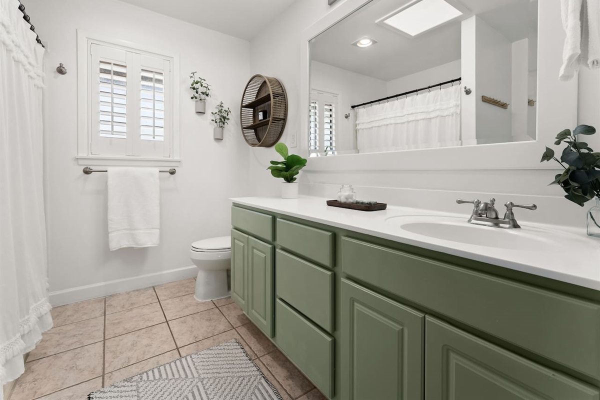 This 2nd floor bathroom offers attached access to "bedroom 2" and has another door at the hallway for shared access.